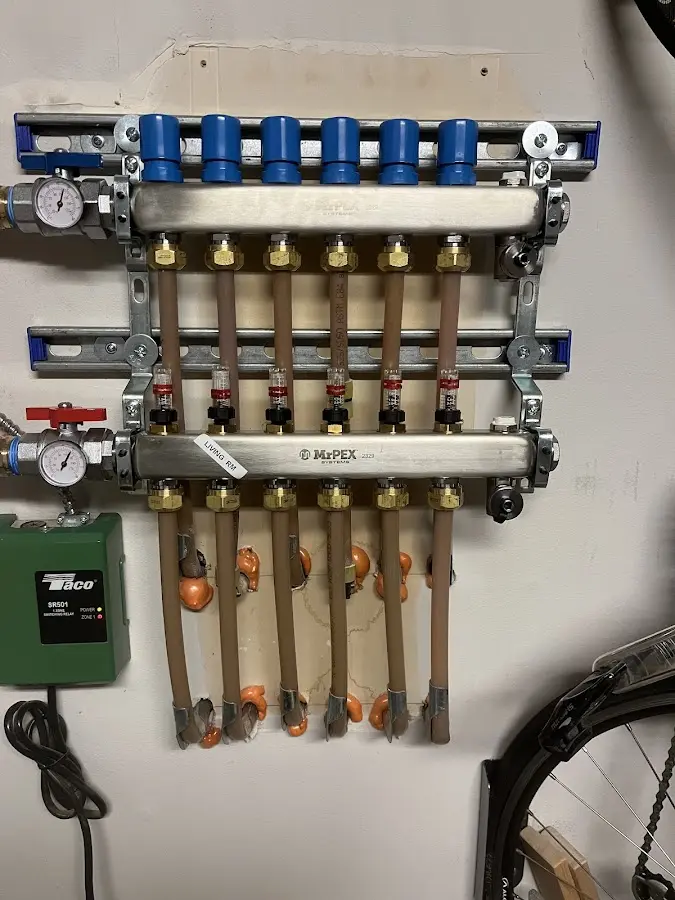 Plumber performing Leak Detection at a residential property in Harlan